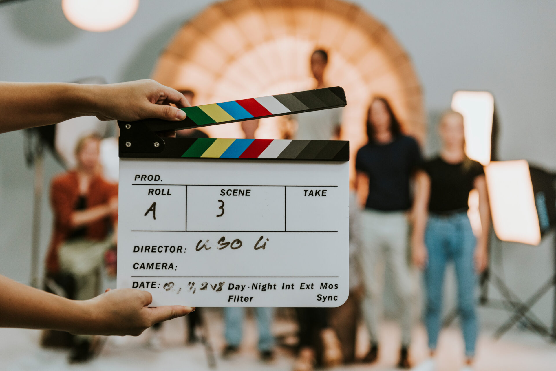 Woman holding a movie production clapperboard