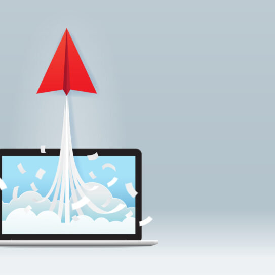 Startup business project concept with red paper plane launch from laptop screen on gray background