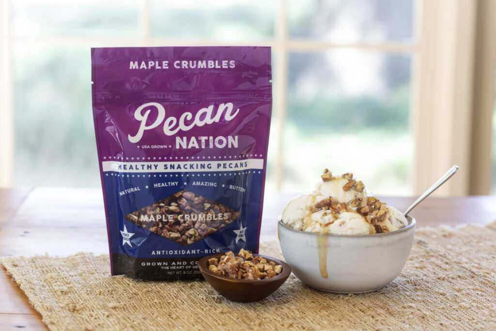 Product image of a package of Pecan Nation pecans paired with a bowl of ice cream