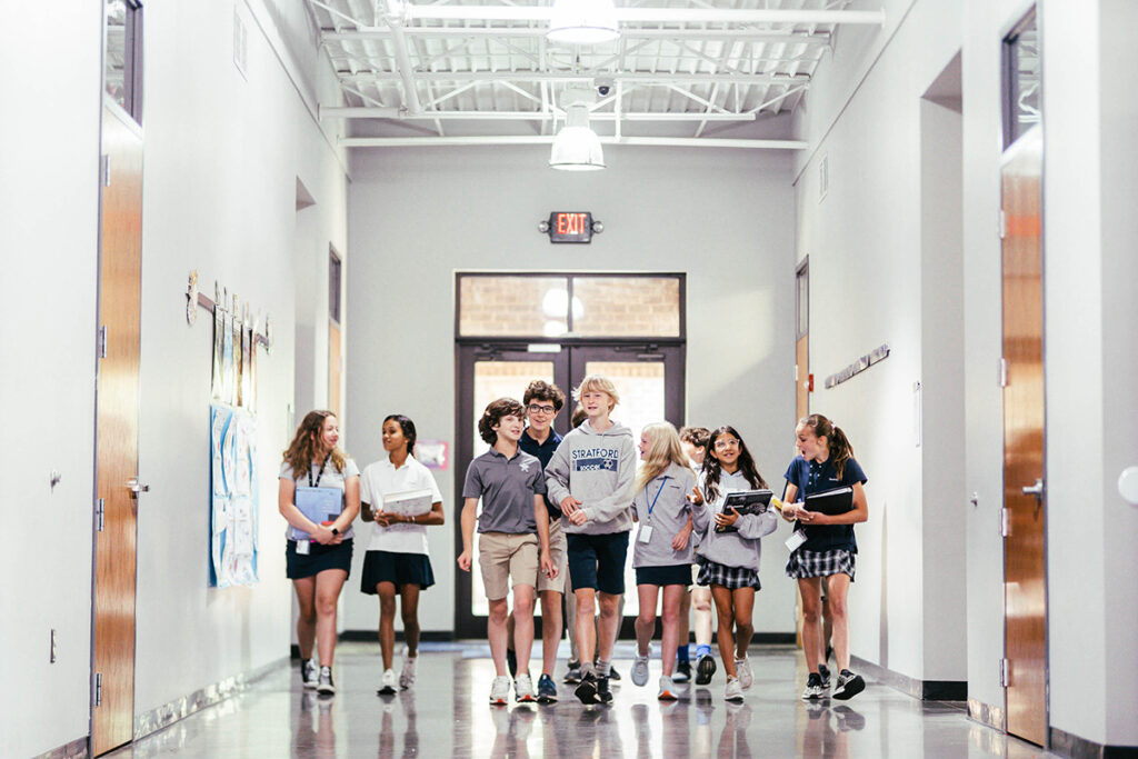 Students of Stratford Academy walking in the hallway together.